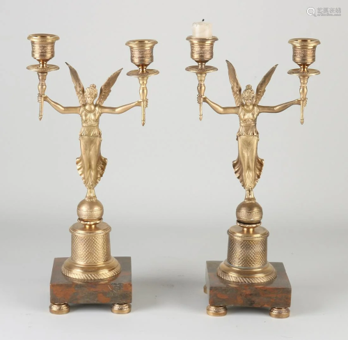 Two bronze Empire style candlesticks with marble base