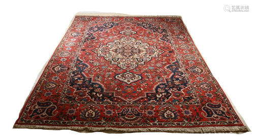 Very large Persian rug with multicolored floral decor.