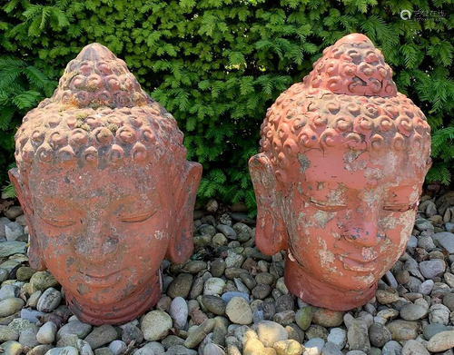 Two ancient Buddha heads of terracotta. 20th century.