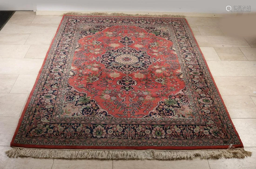 Large Persian rug with floral decor. Brick