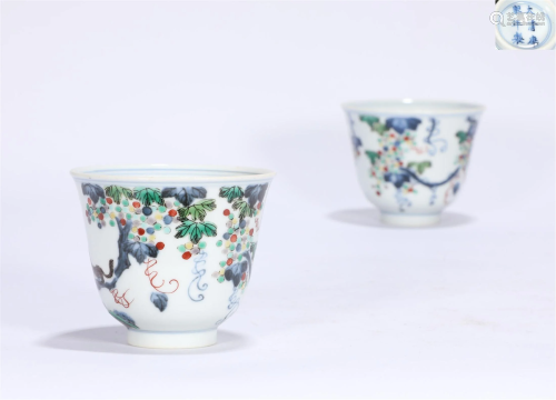 A pair of Kangxi blue and white squirrel grape cups in