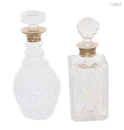 Two silver topped decanters,