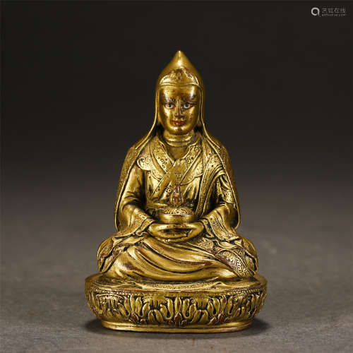 A Gilt-bronze Seated Master Guru