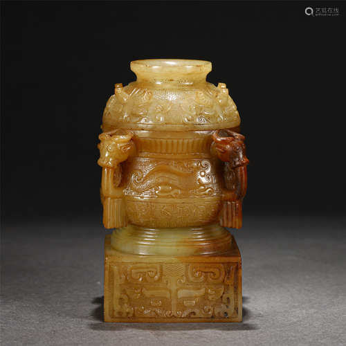 A Carved Creamy and Russet Jade Zun Wine Vessel