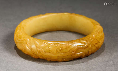 A Carved Yellow Jade Bangle