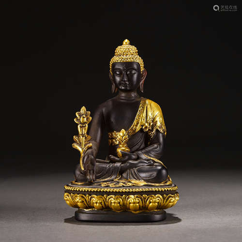 A Peking Glass Parcel Gilt Seated Medicine Buddha