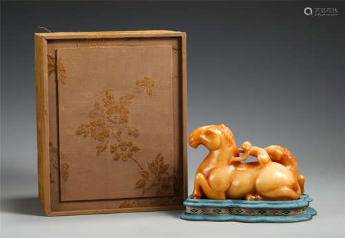 A Carved Yellow Jade Monkey on Horses Group