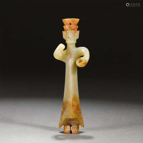 A Carved Celadon and Russet Jade Standing Figure