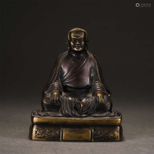 A Gilt-bronze Seated Master Guru