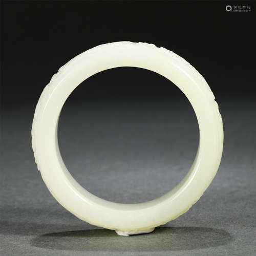 A Carved White Jade Bangle