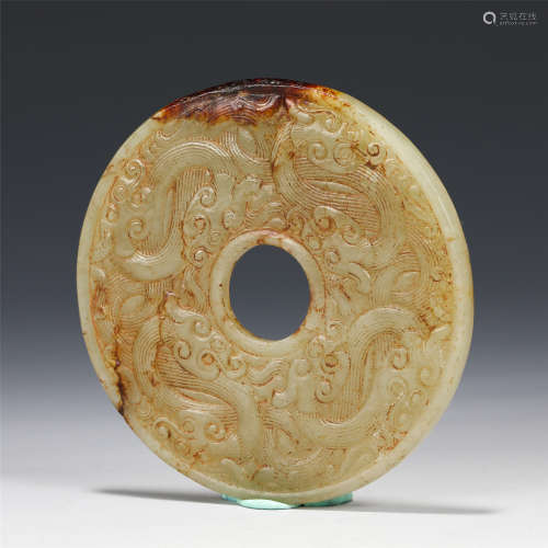 A Carved Creamy Jade Dragon Bi