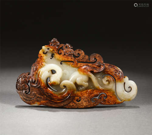 A Carved White and Russet Jade Ornament