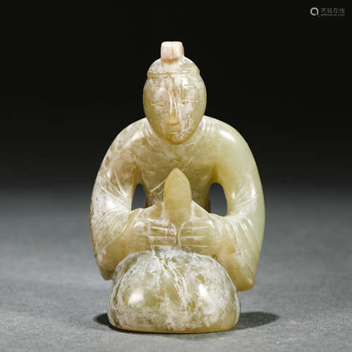 A Carved Celadon Jade Seated Figure