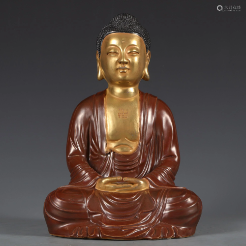 An Aubergine Glazed and Gilt Seated Buddha