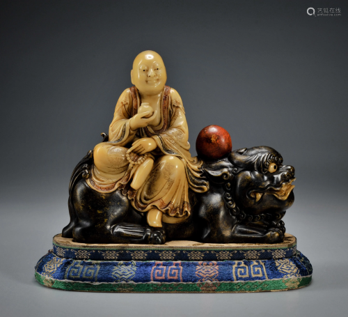 A Carved Seated Tianhuang Figure
