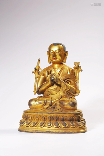 A GILT-BRONZE FIGURE OF GURU.QING PERIOD