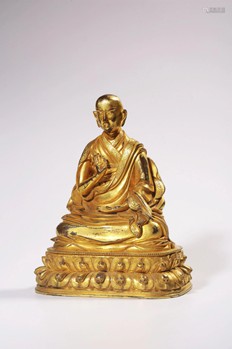 A GILT-BRONZE FIGURE OF GURU.QING PERIOD