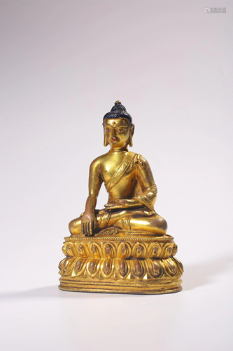 A GILT-BRONZE FIGURE OF SAKYAMUNI.QING PERIOD