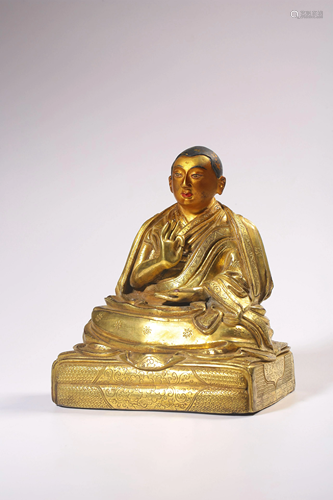 A GILT-BRONZE FIGURE OF GURU.QING PERIOD