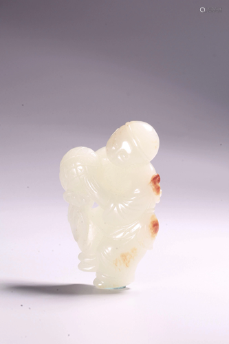 A CARVED WHITE JADE BOY