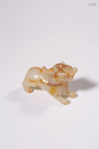 A CARVED WHITE JADE BEAST