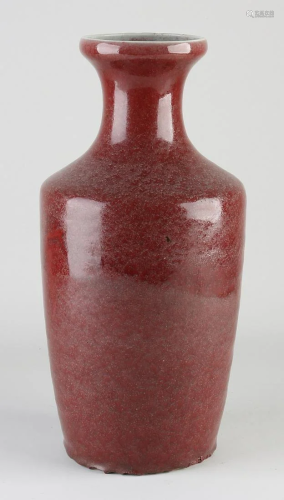 Large antique Chinese porcelain vase with red glaze.