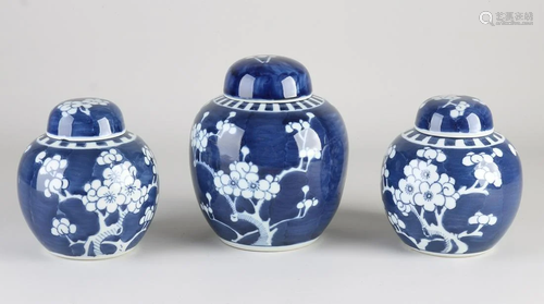 Three Chinese porcelain ginger jars with floral decor.