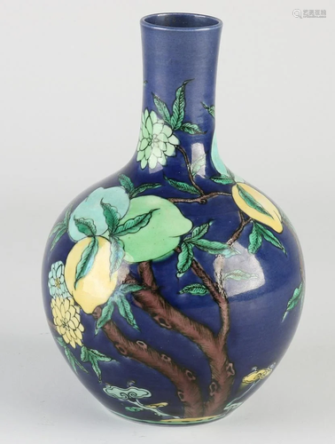 Chinese porcelain vase with blue glaze and peach tree