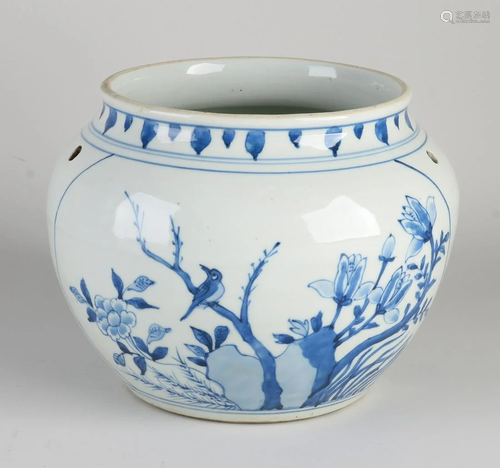 Chinese porcelain pot with blue garden decor. With