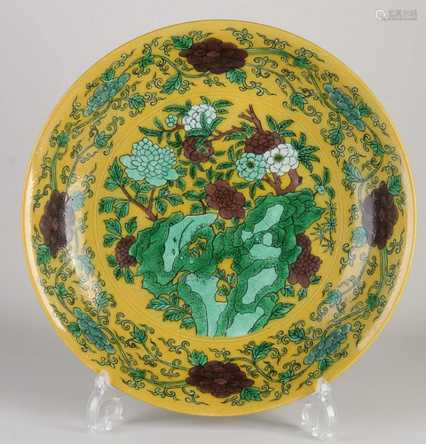 Large Chinese porcelain dish with garden decor. Yellow