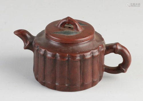 Small Chinese Yixing teapot with bamboo decor. With