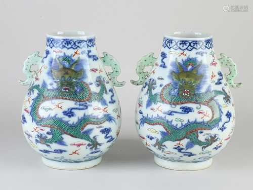 Two Chinese porcelain vases with ears and dragon decor.