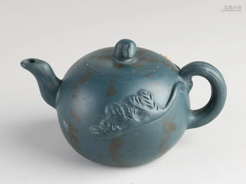 Old Chinese Yixing teapot with floral decor. With