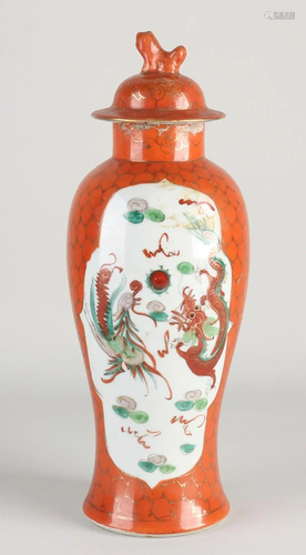 Chinese porcelain vase with dragon/phoenix decor. With