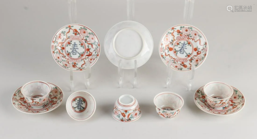 Five Chinese porcelain cups and saucers with floral