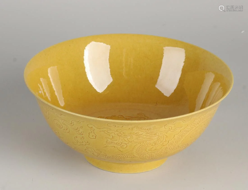 Chinese porcelain dragon bowl with ocher yellow glaze