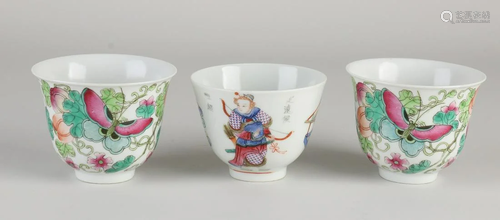 Three Chinese porcelain cups. Two with floral/butterfly