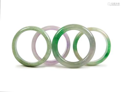 FOUR JADE / VARIED STONE BANGLES