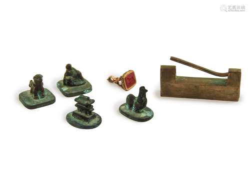 GROUP OF SIX BRONZE SEAL, LOCK AND DOG INTAGLIO
