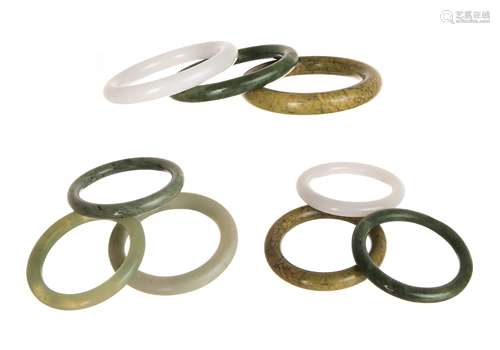 GROUP OF NINE VARIED JADE BANGLES