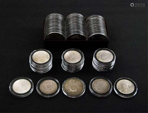 A COLLECTION OF FIFTY-EIGHT CHINESE SILVER COINS