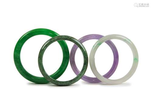 FOUR JADE / VARIED STONE BANGLES