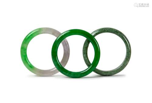 THREE JADE / VARIED STONE BANGLES