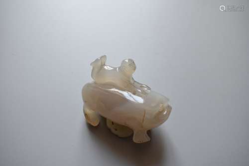 Agate carving of boy riding a three legged toad