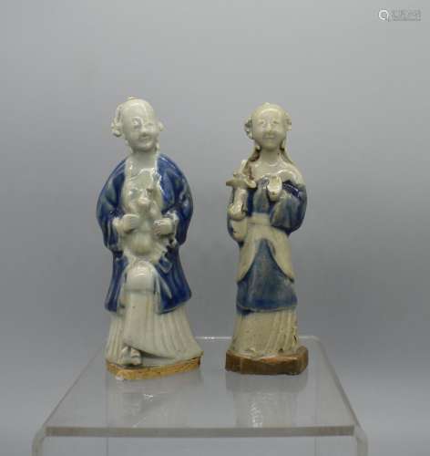 TWO Chinese Biscuit Porcelain Figures holding a Doll and Bas...