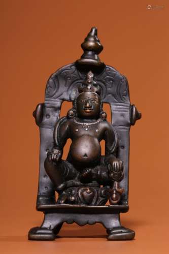 In the 8th century, the seated figure of the god of wealth i...