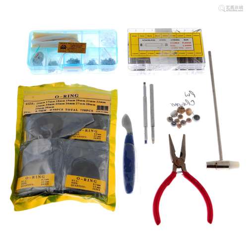 An group of assorted watch tools and watch parts, to include...