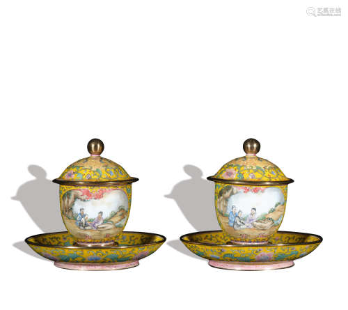 A pair of enamel 'figure' teacup
