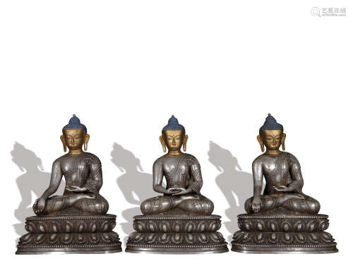 A set of silver statue of Trikalea Buddhas