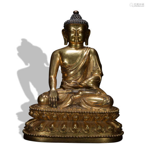 A gilt bronze figure of shakyamuni